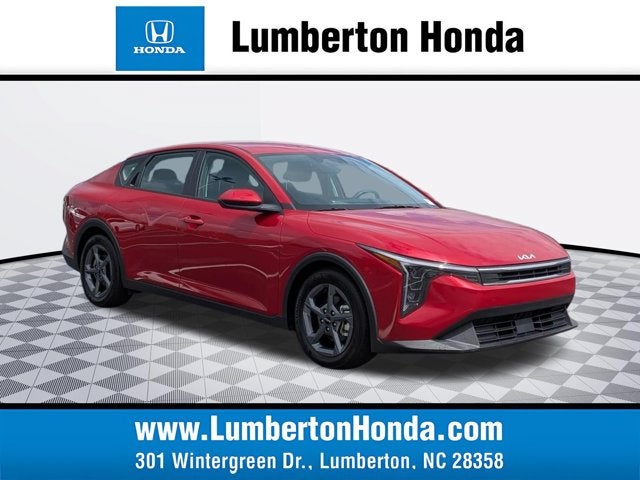 2025 Kia K4 LXS in Currant Red — front three-quarter view